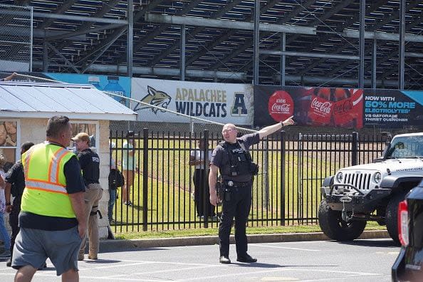 WINDER, GEORGIA - SEPTEMBER 4: Students are directed to be picked up by their parents after a shooting at Apalachee High School on September 4, 2024 in Winder, Georgia. Four fatalities and multiple injuries have been reported, and a 14-year-old suspect is in custody according to authorities. (Photo by Megan Varner/Getty Images)