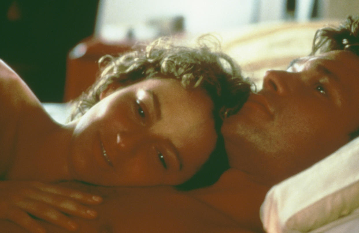 American actors Patrick Swayze (1952 - 2009) and Jennifer Grey enjoy a post-coital moment in the film 'Dirty Dancing', 1987. (Photo by /Getty Images)