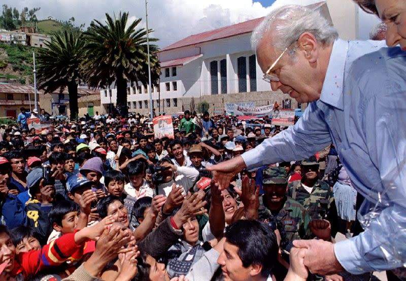 FILE PHOTO: Former United Nations Secretary General and presidential candidate Javier Perez de Cuellar greets supporters in Sicuani April 5 after he give a public speech during a campaign rally in the Andes, Peru