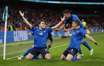 Italy's Federico Chiesa, left, celebrates with his teammates after scoring his side's opening goal during the Euro 2020 soccer championship round of 16 match between Italy and Austria at Wembley stadium in London, Saturday, June 26, 2021. (AP Photo/Frank Augstein, Pool)