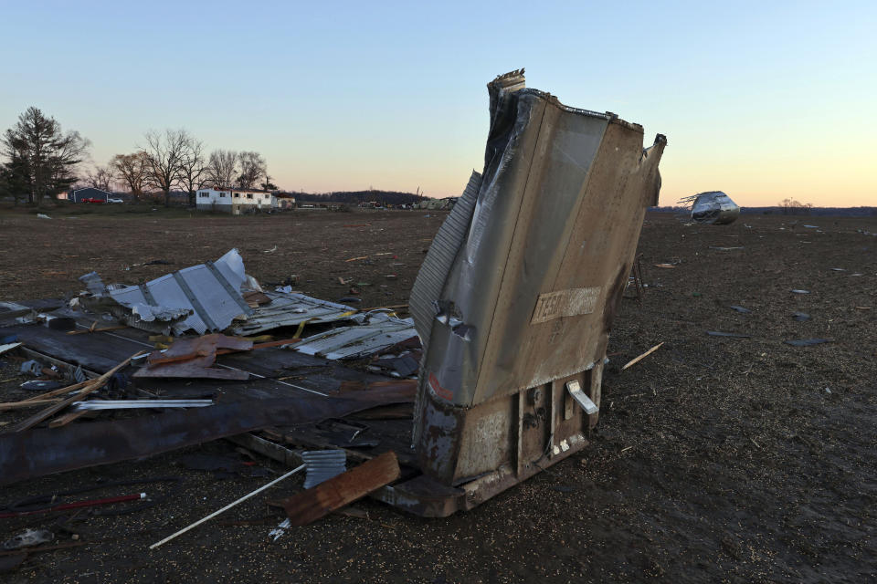 Debris from a farm building nearby sits in a field along North Tolles Road in Evansville, Wis., Friday morning, Feb. 9, 2024, after a confirmed tornado traveled through the area just northwest of Evansville, Wis., the prior evening. The tornado was the first-ever reported in February in the state of Wisconsin, according to the National Weather Service. (Anthony Wahl//The Janesville Gazette via AP)