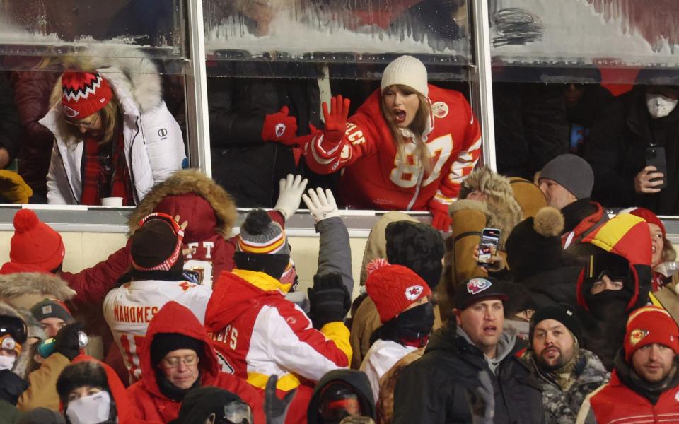 Taylor Swift celebrates with fans during a match at the Kansas City Chiefs' Arrowhead Stadium this month