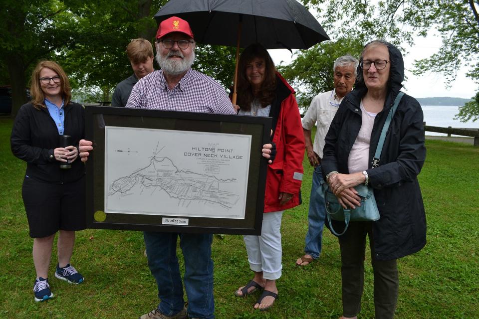 Stephen Roberts of Rollinsford holds a map of Dover Neck Village, the settlement his ancestor Thomas Roberts helped found on Hilton Point in Dover after a ceremony honoring the Hilton and Roberts families on Saturday, June 24, 2023 as part of Dover's 400th birthday celebration.