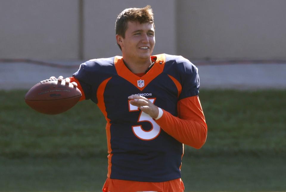 Denver Broncos quarterback Drew Lock takes part in drills during a camp practice.