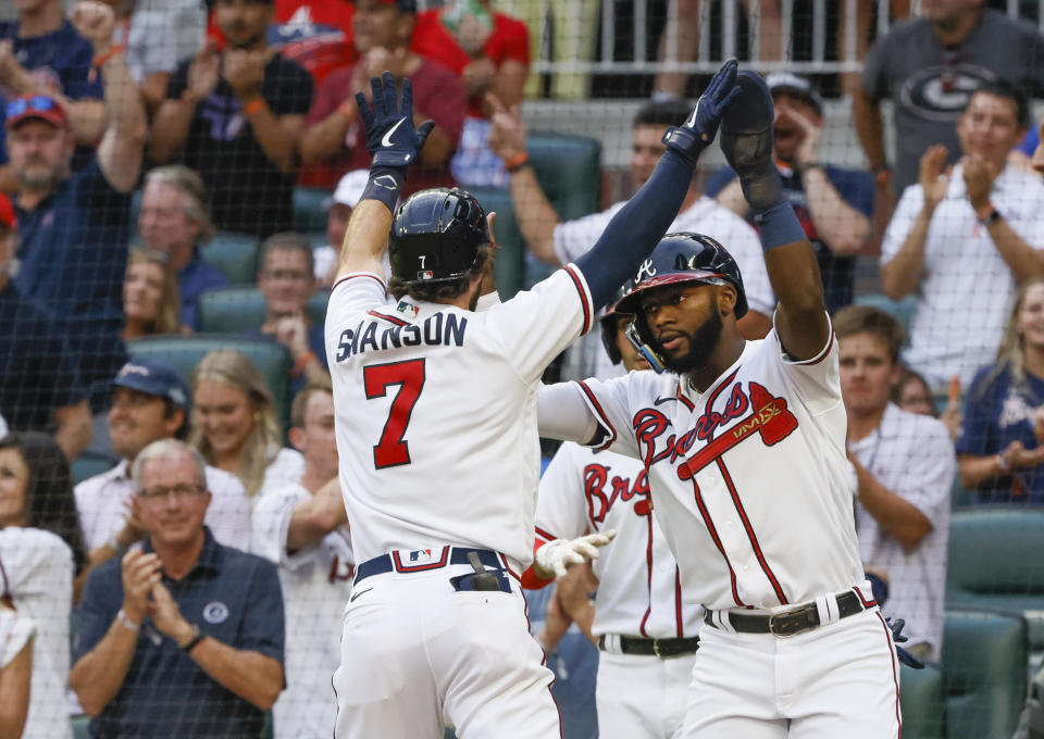 Atlanta Braves' Dansby Swanson celebrates with Michael Harris after hitting a two-run home run against the Los Angeles Dodgers during the third inning of a baseball game Saturday, June 25, 2022, in Atlanta. (AP Photo/Bob Andres)