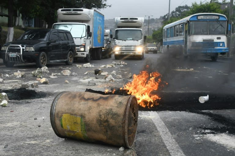 Protesters in Honduras erected burning barricades after President Juan Orlando Hernandez was declared the winner of a heavily disputed election