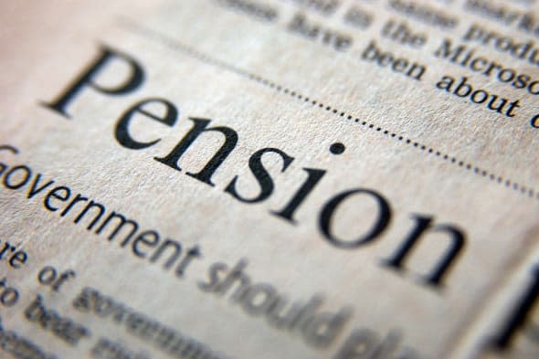 A2CWRN Royalty free photograph of pension business headline in UK financial times pension; retirement; old; age; pensioner; prop