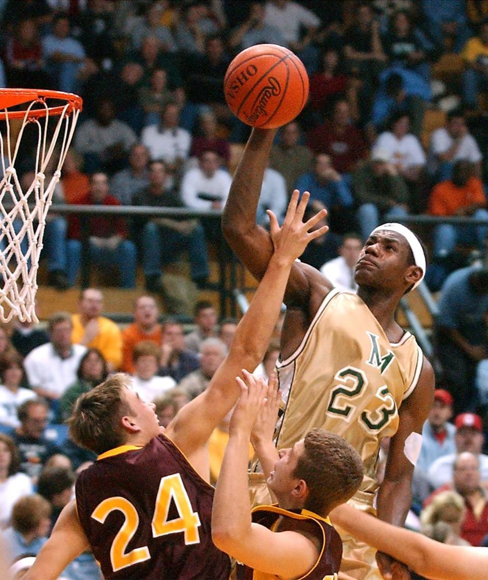 LeBron James elevates for a shot during a St. Vincent-St. Mary game against Avon Lake on Nov. 30, 2001, at the University of Akron's Rhodes Arena.