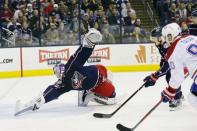 Jan 18, 2019; Columbus, OH, USA; Montreal Canadiens left wing Tomas Tatar (20) scores over the stick of Columbus Blue Jackets goalie Joonas Korpisalo (70) during the first period at Nationwide Arena. Mandatory Credit: Russell LaBounty-USA TODAY Sports