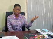 Dumebi Iyeke, a research analyst with Financial Derivatives, speaks during an interview with Reuters at her office in Lagos