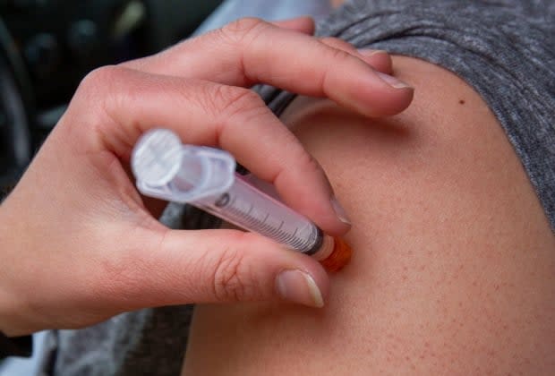 The health authority said since the announcement of the proof of vaccination policy, more doses have been going into the arms of Saskatchewan residents.  (Lars Hagberg/The Canadian Press - image credit)