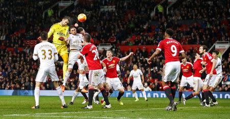 Football Soccer - Manchester United v Swansea City - Barclays Premier League - Old Trafford - 2/1/16 Swansea's Lukasz Fabianski heads at goal Action Images via Reuters / Carl Recine Livepic