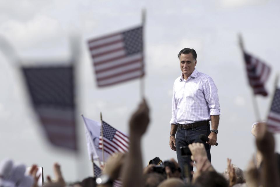 FILE - Republican presidential candidate, former Massachusetts Gov. Mitt Romney appears on stage during a campaign event at Lakeland Linder Regional Airport, Aug. 31, 2012, in Lakeland, Fla. (AP Photo/Mary Altaffer, File)