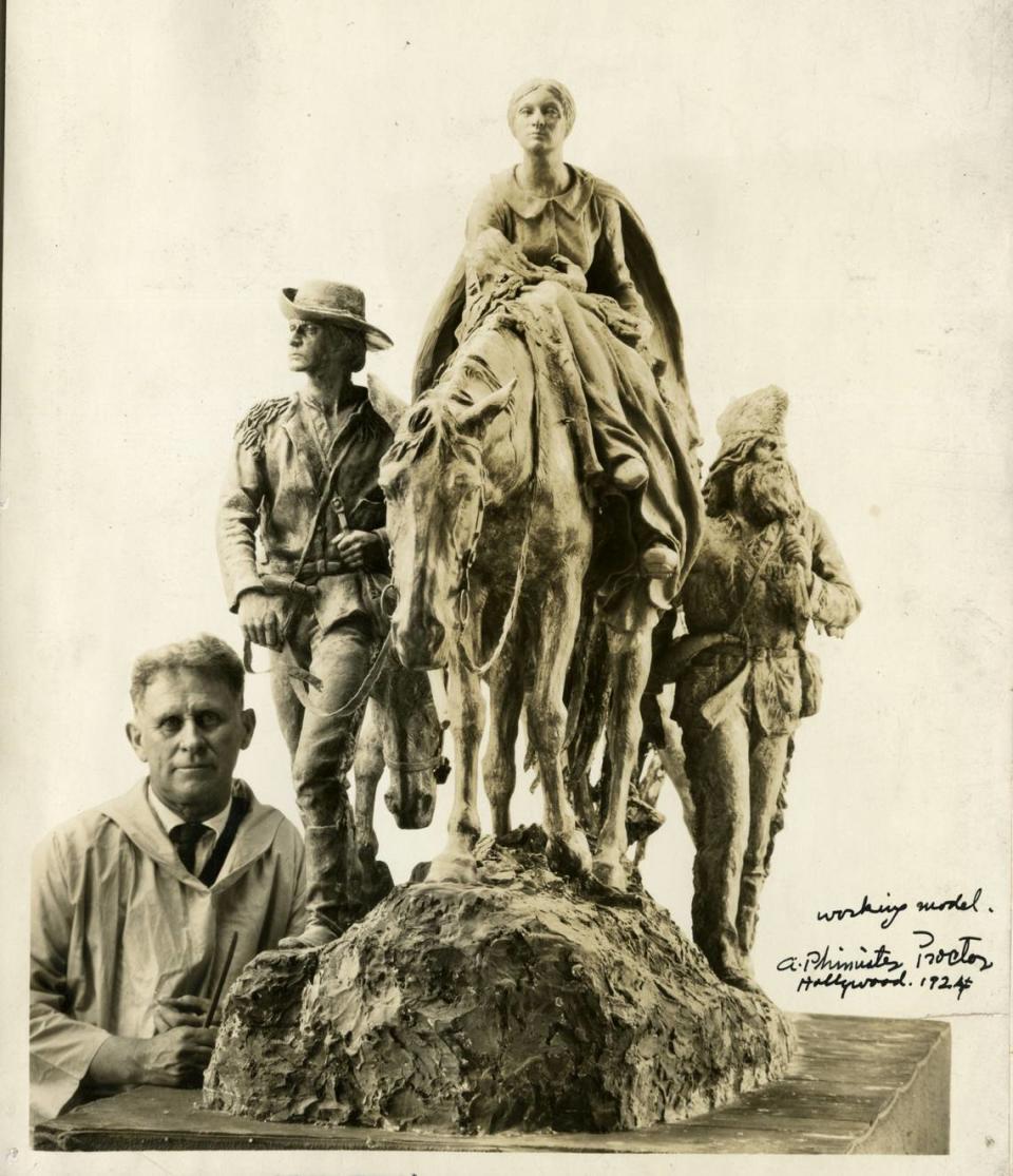 Proctor with a working model of Pioneer Mother, 1924