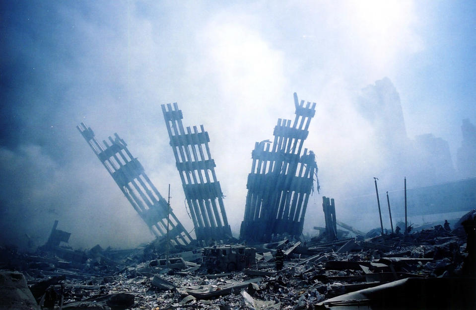 <p>The rubble of the World Trade Center smoulders. (Getty)</p> 