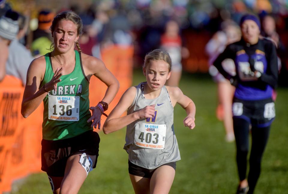 Williamsville's Louisa Wilson (403) battles Eureka's Anna Perry in the Class 1A girls state cross country championship Saturday, Nov. 6, 2021 at Detweiller Park in Peoria. Wilson finished third in a time of 17.34.48. Perry finished fourth. Williamsville finished sixteenth as a team while Eureka took third place.