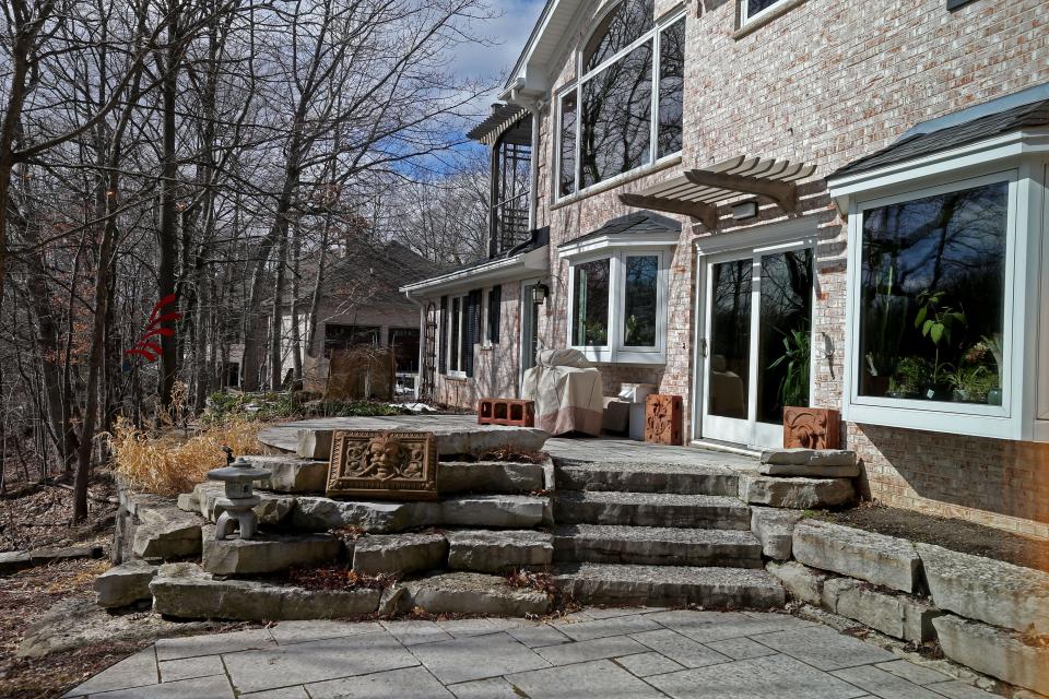 The back of the Bayside home of Scott Kania and Linda Even shows some of their terra cotta collection.  They also created the patios.