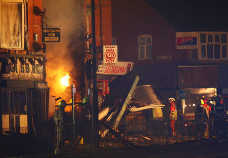 Members of the emergency services work at the site of an explosion which destroyed a convenience store and a home in Leicester, Britain, February 25, 2018. REUTERS/Darren Staples