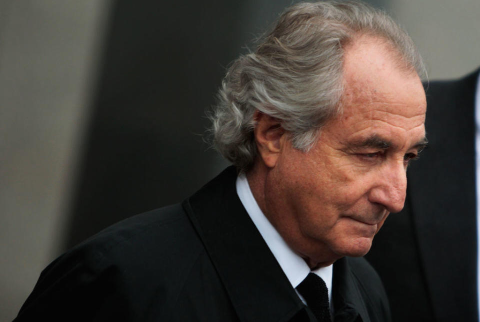 Bernie Madoff in a suit leaving court