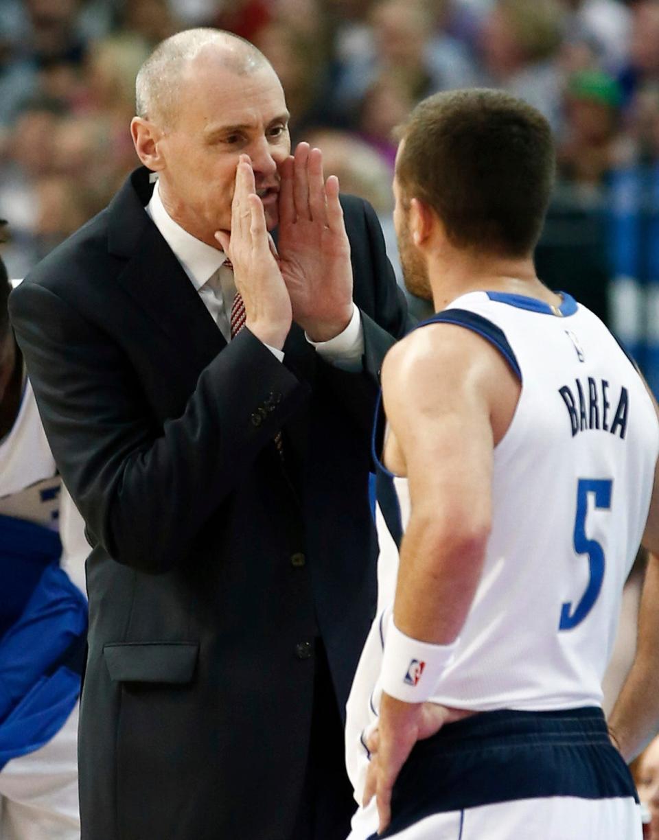 Dallas Mavericks head coach Rick Carlisle, left, talks with Dallas Mavericks guard J.J. Barea (5), of Puerto Rico, during the first period of an NBA basketball game against the New Orleans Pelicans, Friday, Nov. 3, 2017, in Dallas. (AP Photo/Mike Stone)