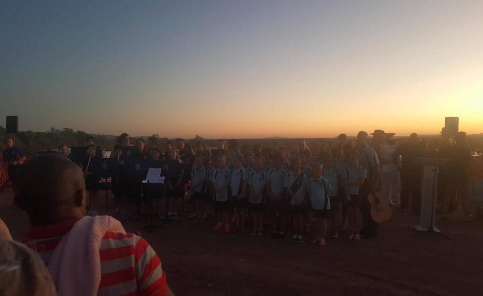 Students perform at the Anzac Day dawn service in Kununurra, Western Australia. Source: Mitchell Ford