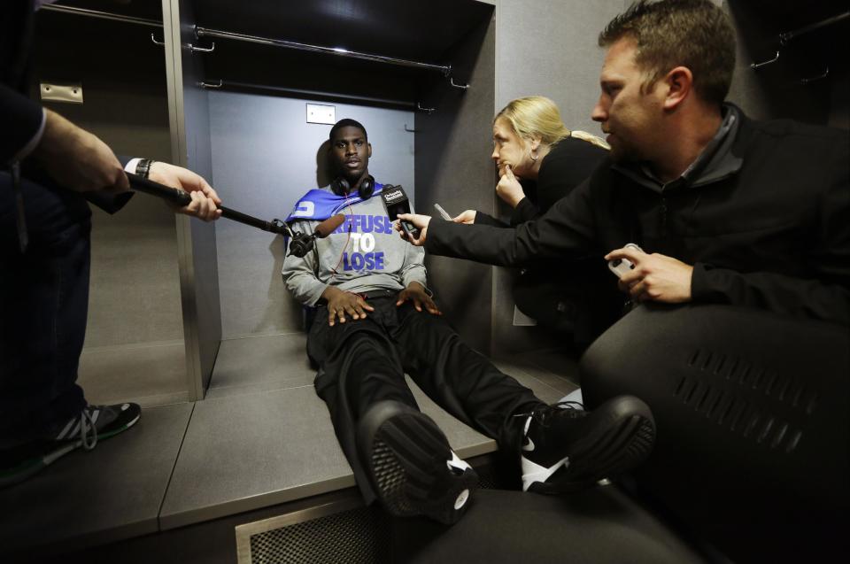 Kentucky forward Alex Poythress is interviewed in the locker room before practice for the NCAA Final Four tournament college basketball championship game Sunday, April 6, 2014, in Arlington, Texas. Kentucky plays Connecticut in the championship game on Monday, April 7. 2014. (AP Photo/Eric Gay)