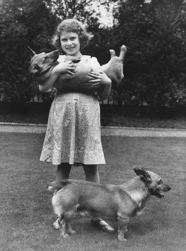 Princess Elizabeth with two corgi dogs at her home at 145 Piccadilly, London, in 1936. (Photo: Lisa Sheridan/Studio Lisa/Hulton Archive/Getty Images)