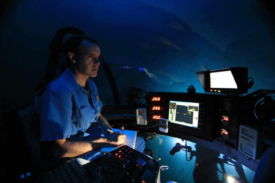 Off the coast of Chile's San Felix Island, National Geographic Explorer in Residence Enric Sala documents observations of deep sea fauna from the DeepSee submarine at a depth of 250 meters.<span class="copyright">Avi Klapfer—National Geographic</span>