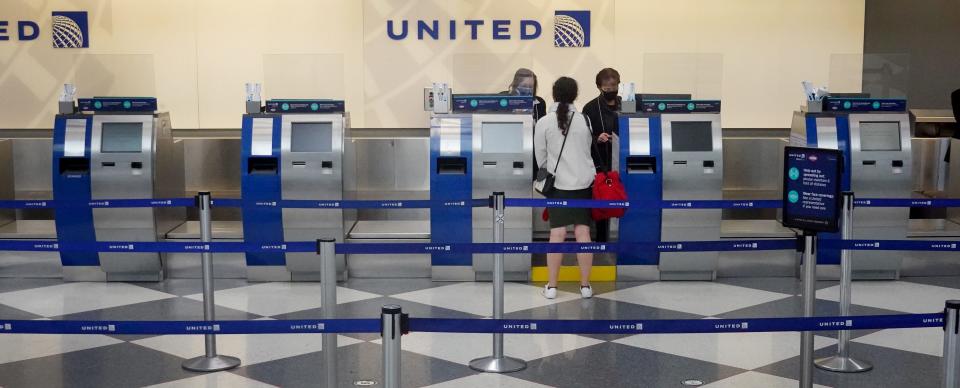 A traveler checks in for a flight at O'Hare International Airport on Nov. 24, 2020, in Chicago.