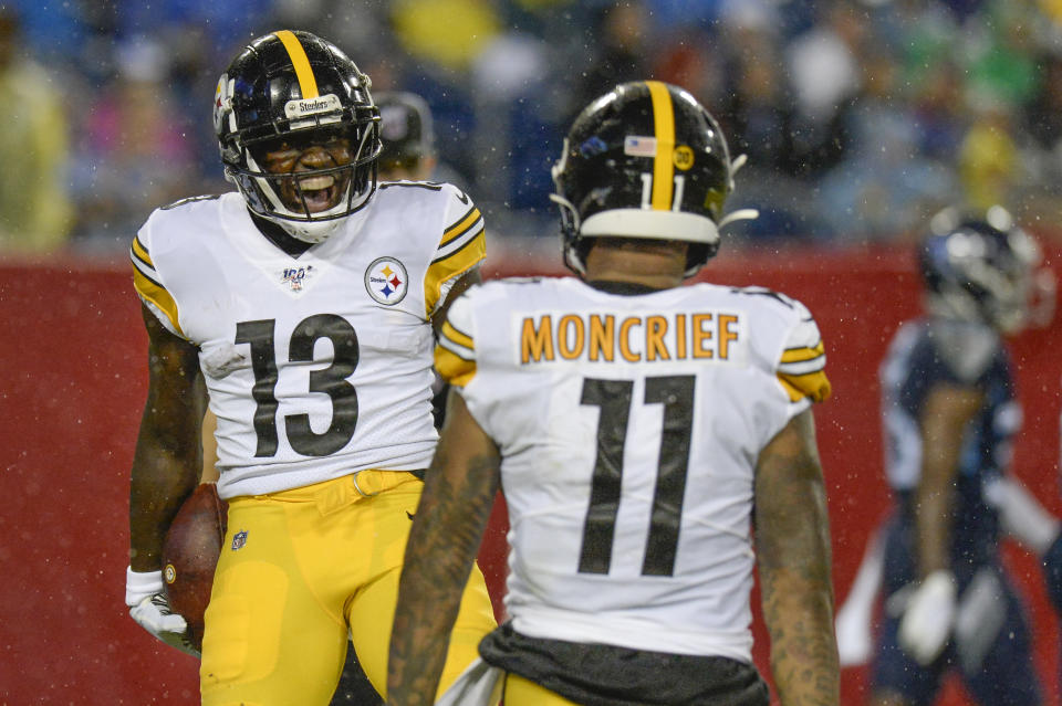 Pittsburgh Steelers wide receiver James Washington (13) celebrates with Donte Moncrief (11) after Washington scored a touchdown on a 41-yard pass play against the Tennessee Titans in the first half of a preseason NFL football game Sunday, Aug. 25, 2019, in Nashville, Tenn. (AP Photo/Mark Zaleski)