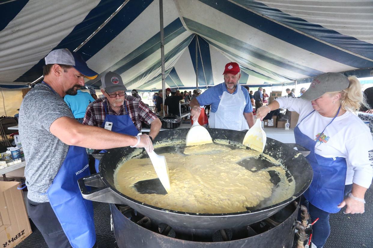 FILE - A view from Breakfast on the Farm in 2021. Paul Reetz, Ray Halbur, State Rep. Timothy Ramthun and Lisa McArthur make scrambled eggs Sunday, June 27, 2021. The event was at LaClare Family Creamery in Pipe.