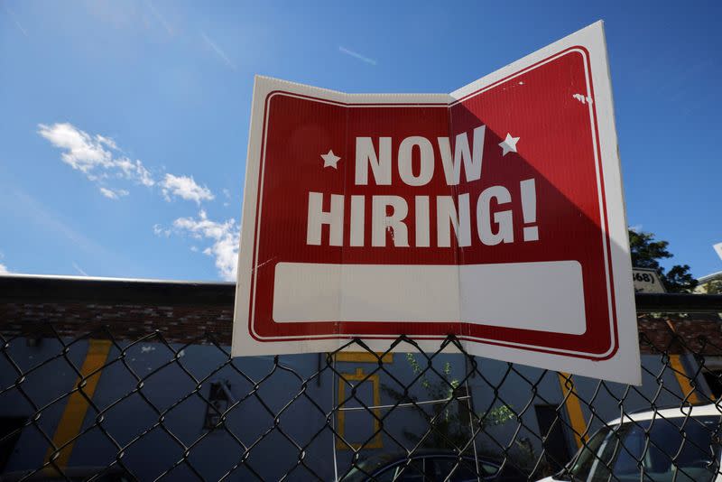 FILE PHOTO: A "now hiring" sign is displayed in Somerville