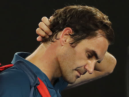 Tennis - Australian Open - Fourth Round - Melbourne Park, Melbourne, Australia, January 20, 2019. Switzerland’s Roger Federer leaves the court after losing the match against Greece’s Stefanos Tsitsipas. REUTERS/Adnan Abidi