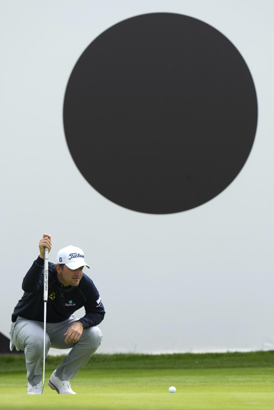 Bernd Wiesberger of Austria lines up a putt on the 18th green during the first round of the inaugural LIV Golf Invitational at the Centurion Club in St. Albans, England, Thursday, June 9, 2022. (AP Photo/Alastair Grant)