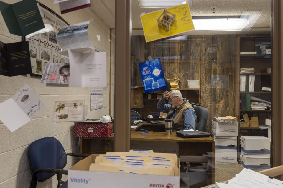 Mayor Bill Thek sits in in his office in City Hall, Wednesday, Jan. 12, 2022, in Kemmerer, Wyo. Thek said he was ecstatic about his town being chosen as the site of a nuclear reactor. (AP Photo/Natalie Behring)