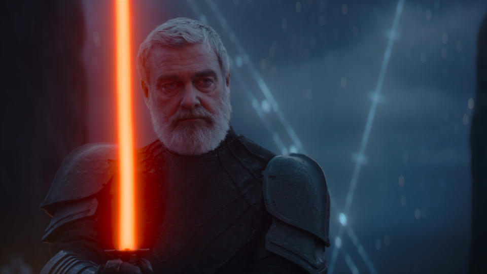 Ray Stevenson brandishes his red lightsaber as Baylon in Ahsoka.