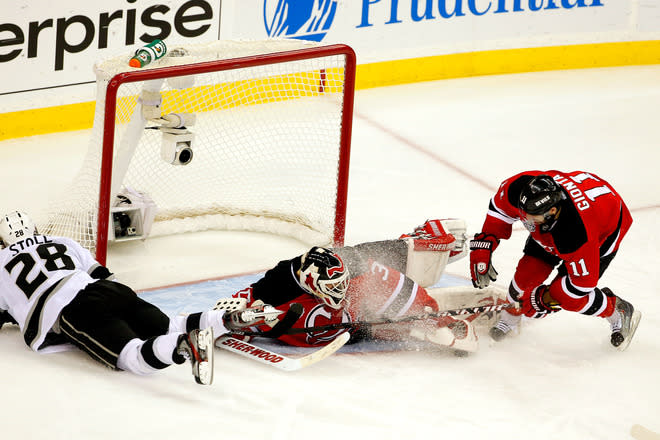 NEWARK, NJ - JUNE 09: Martin Brodeur #30 of the New Jersey Devils makes a save in front of Stephen Gionta #11 and Jarret Stoll #28 of the Los Angeles Kings during Game Five of the 2012 NHL Stanley Cup Final at the Prudential Center on June 9, 2012 in Newark, New Jersey. (Photo by Paul Bereswill/Getty Images)