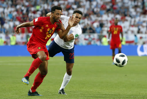 Head-to-head: Moussa Dembele vies for the ball with England’s Trent Alexander-Arnold