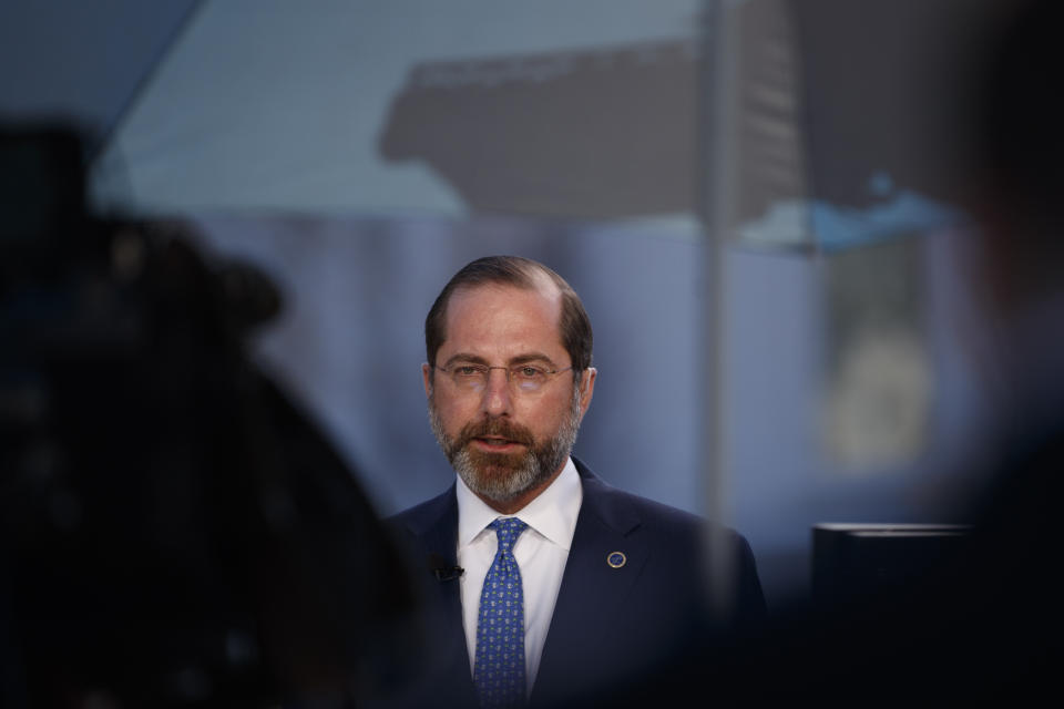 Health and Human Services Secretary Alex Azar speaks during a television interview outside the White House in Washington, Monday, March, 9, 2020. (AP Photo/Carolyn Kaster)