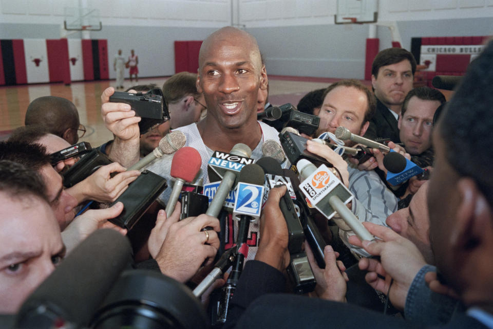 Michael Jordan talks to the press three days after announcing his return. (Brian Bahr/AFP via Getty Images)