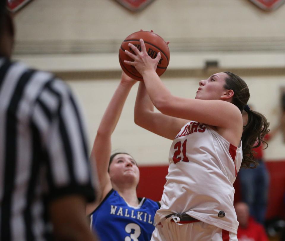 Red Hook's Emilie Kent goes up for a shot over Wallkill's Gabby Gualtiere during a Jan. 12, 2024 girls basketball game.