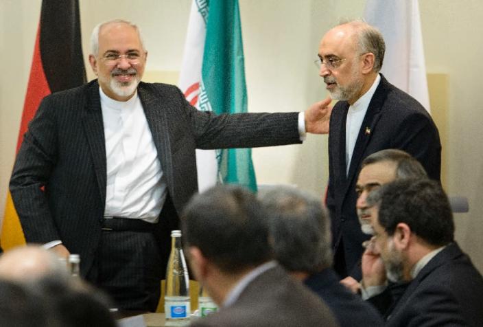 Iranian Foreign Minister Mohammad Javad Zarif (L) greets Atomic Energy Organization of Iran head Ali Akbar Salehi at the Beau Rivage Palace Hotel on March 31, 2015 in Lausanne (AFP Photo/Brendan Smialowski)
