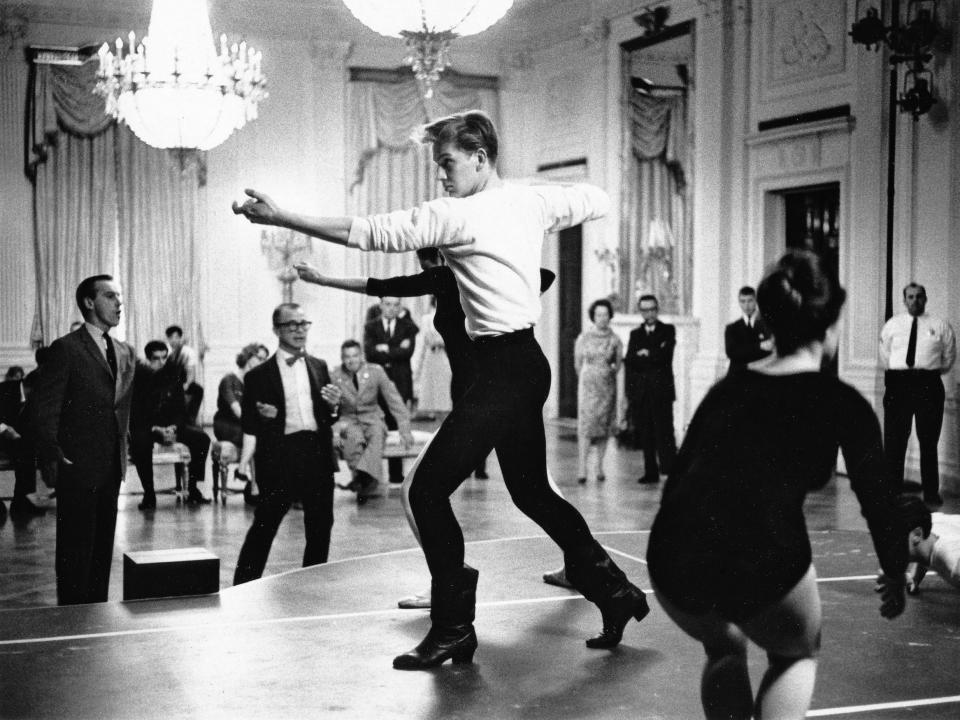 Composer Aaron Copeland and choreographer Eugene Loring with the American Ballet Theatre rehearse before a performance of "Billy the Kid" for the Kennedys in the White House in 1962.