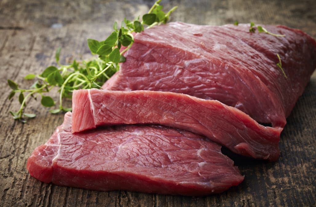 fresh raw meat on old wooden table