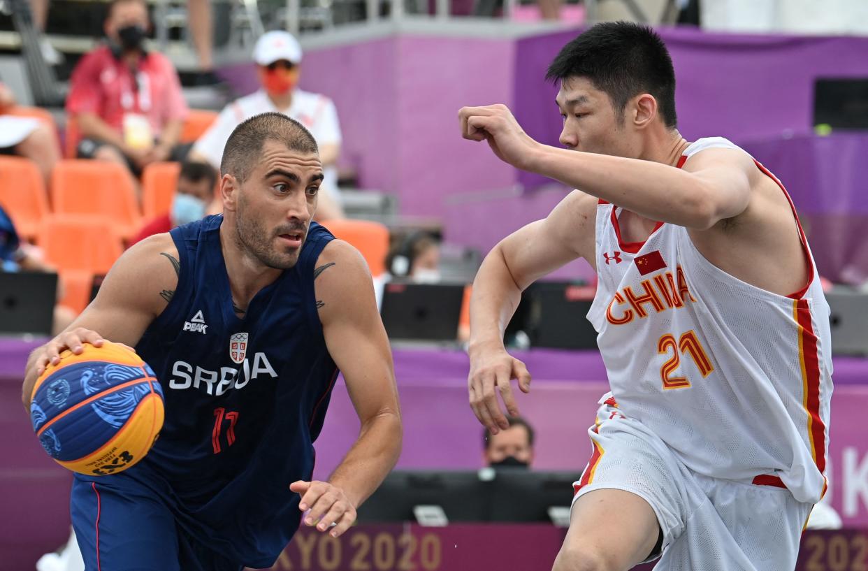 Serbia's Dusan Bulut (left) and other 3x3 basketball players may not be the same talent level as NBA players, but that doesn't mean the 5-on-5 pros would just walk in and dominate. (Photo by ANDREJ ISAKOVIC/AFP via Getty Images)