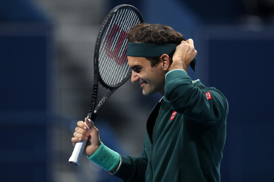 DOHA, QATAR - MARCH 10: Roger Federer of Switzerland walks out to play in his match against Dan Evans of Great Britain on Day 3 of the Qatar ExxonMobil Open at Khalifa International Tennis and Squash Complex on March 10, 2021 in Doha, Qatar. (Photo by Mohamed Farag/Getty Images)