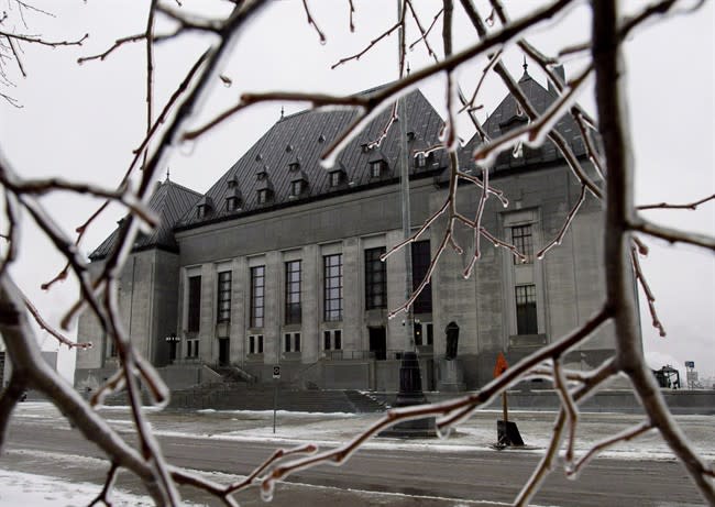 Ice coats tree branches outside of the Supreme Court of Canada in Ottawa on December 10, 2012. A landmark Supreme Court ruling that could reshape Canada's sex trade comes down Friday - 34 years after the court last upheld the country's anti-prostitution laws. THE CANADIAN PRESS/Adrian Wyld