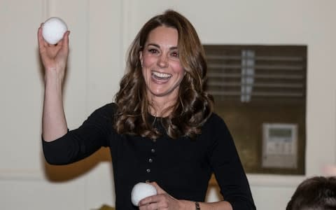 The Duchess of Cambridge takes part in a mock snow ball fight with children - Credit: Richard Pohle