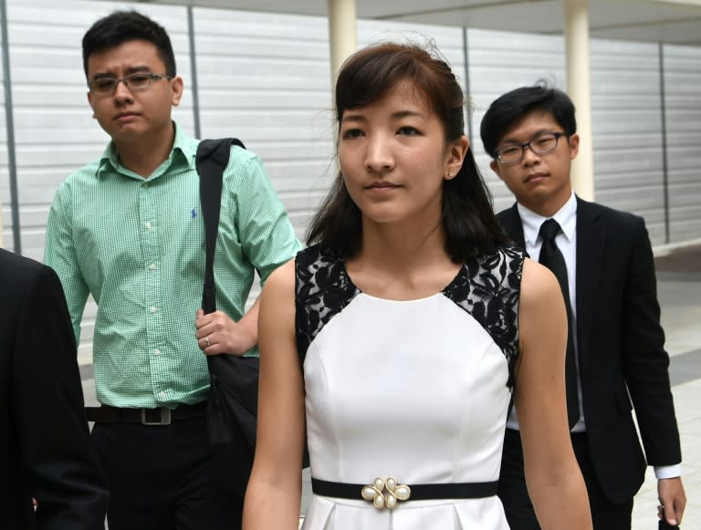 Australian Japanese Ai Takagi (front) and her Singaporean husband Yang Kaiheng (left), each face 7 sedition charges for articles published between October 2013 and February 2015 on the socio-political website "The Real Singapore"