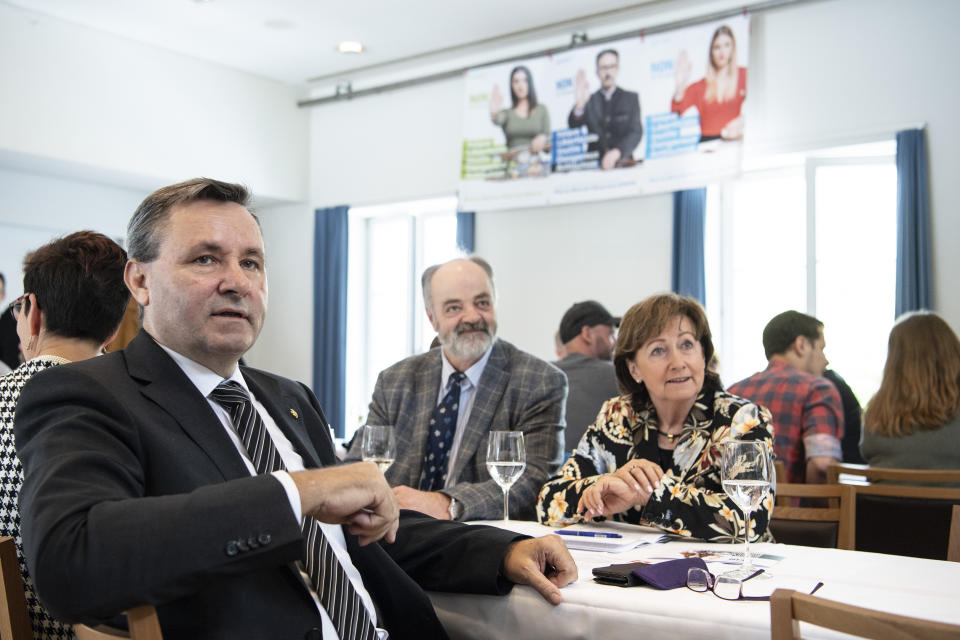 Werner Salzman, front left, Swiss parlamentarian of conservative party SVP and member of the committee against the EU gun laws and policies, speaks at the committee's meeting in Burgdorf, Switzerland, Sunday, May 19, 2019. Swiss voters clearly accepted EU's stricter gun control at the national ballot. (Peter Schneider/Keystone via AP)